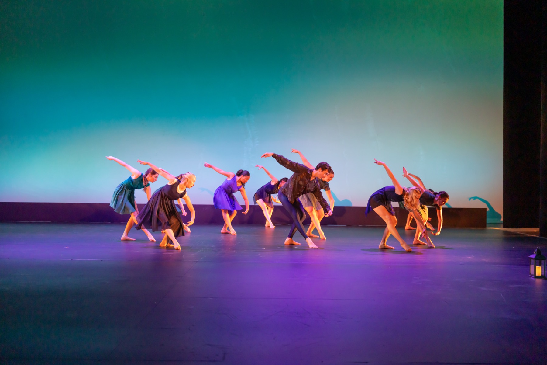 A Lamp to My Feet ensemble extending through a diagonal phrase on stage