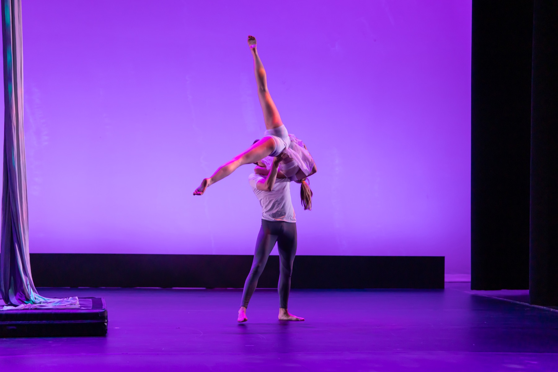 A Light To My Path aerial duet lift under purple stage lighting